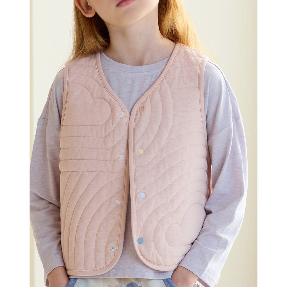 Petite Revery Quilted Cloud Vest Rose Smoke worn by a child, pink padded vest with cloud quilting and snaps