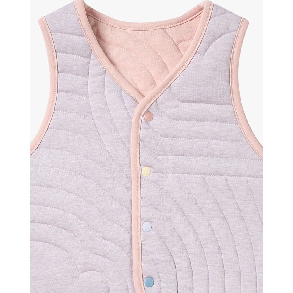 Petite Revery Quilted Cloud Vest Rose Smoke with pink piping, laid flat to show quilted texture and pastel snap buttons.