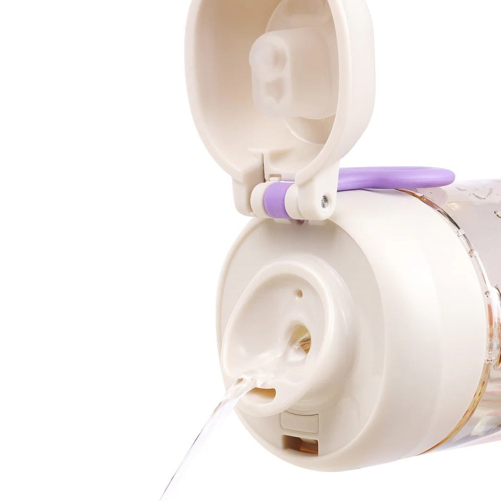 Pigeon Double Port PPSU Drinking Cup 36M+ with white body and purple clip, lid open and liquid pouring.