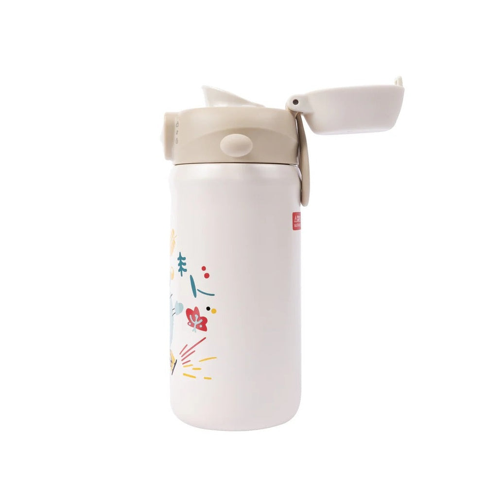 Pigeon Kids Stainless Steel Thermos Drinking Cup, white with colorful print, flip-top lid open for easy sipping.