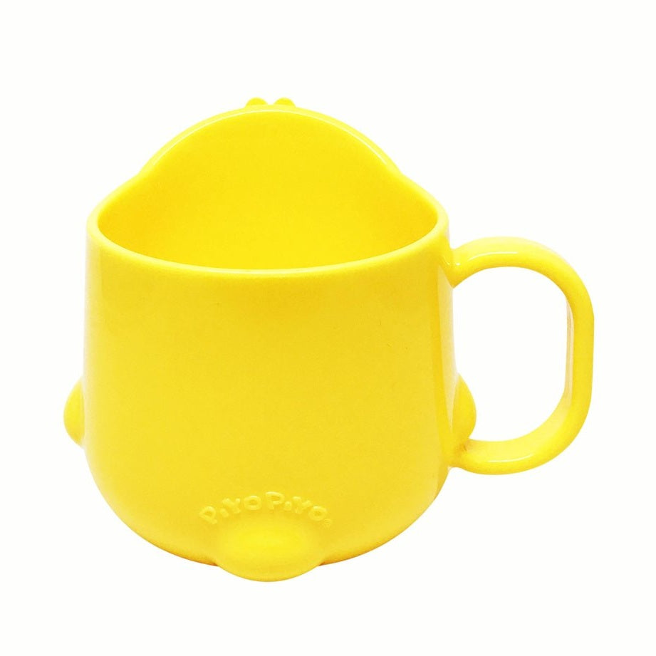 Piyo Piyo Cup yellow plastic baby feeding cup with a sturdy handle, grippable for tiny hands.