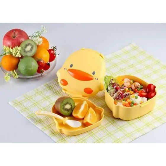Piyo Piyo Foodie silicone placemat yellow with divided sections, shown beside kid-friendly fruit bowls during mealtime.