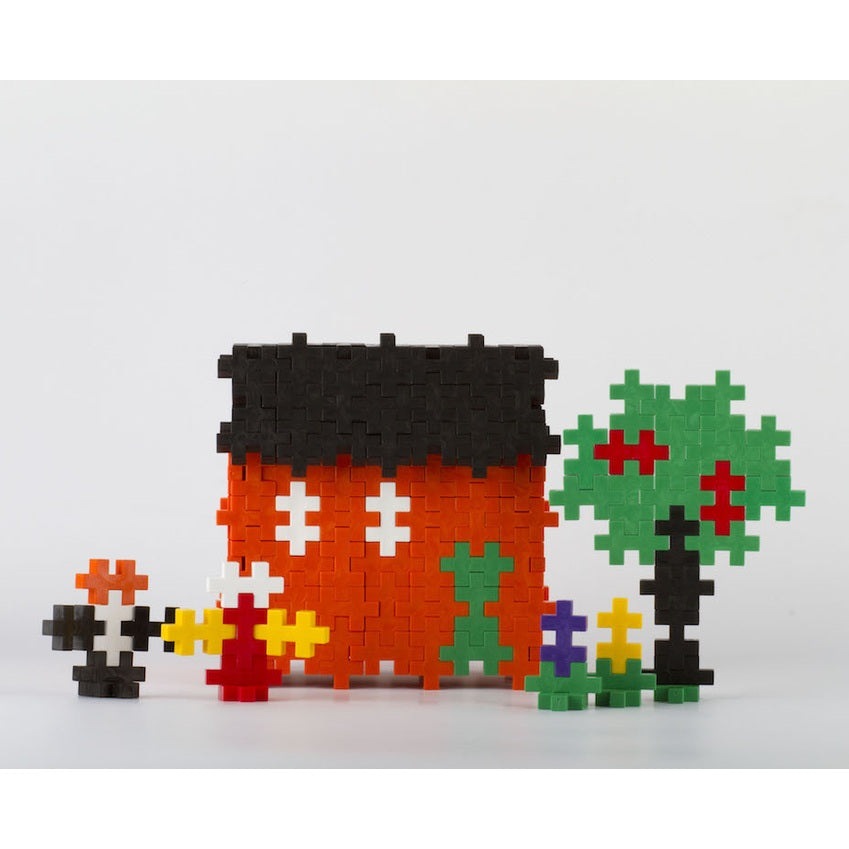 Plus-Plus Big 400 Educational building toy: red house with black roof, green tree, and colorful flowers.