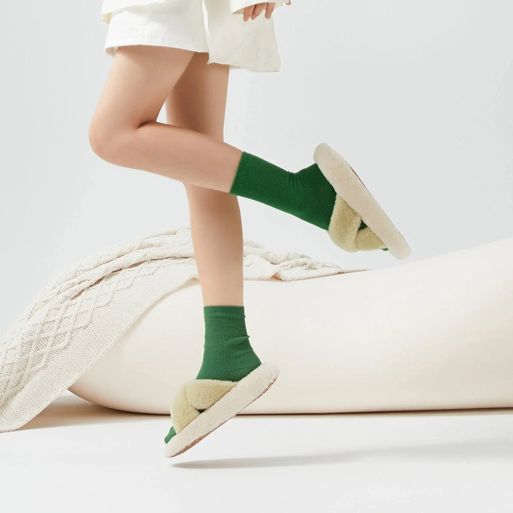 Posee Cross Strap Plush Fashion Slippers Wasabi worn mid-step with green socks and fluffy beige soles