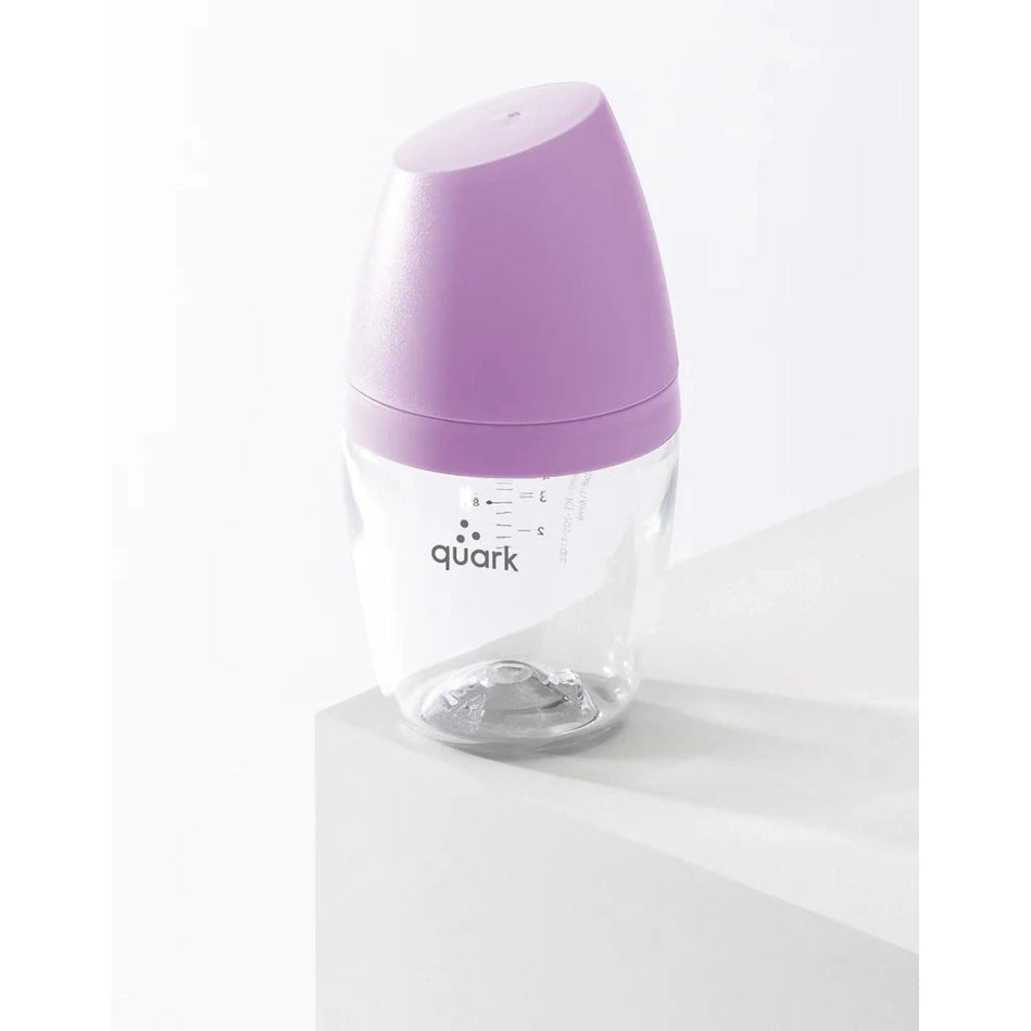 Quark Buubibottle Mini Hybrid Feeding Bottle 1 Pack standing on a white surface with purple cap and measurement marks.