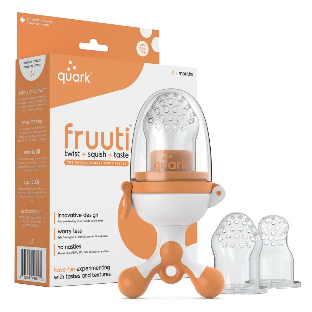Quark Fruiti baby fruit feeder pacifier with orange handle, clear dome, and two replacement nipples.