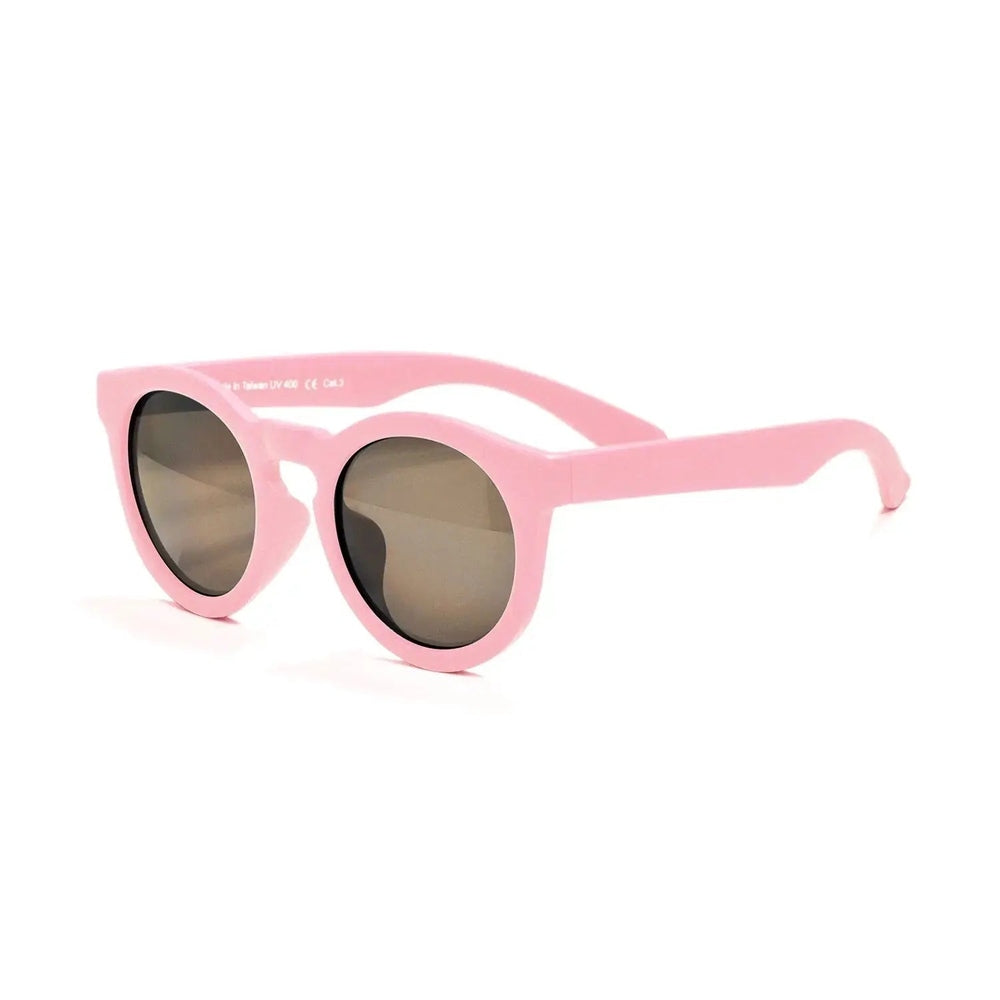 Real Shades Chill sunglasses Kids Dusty Rose, pink frame with round gray lenses resting on a white background
