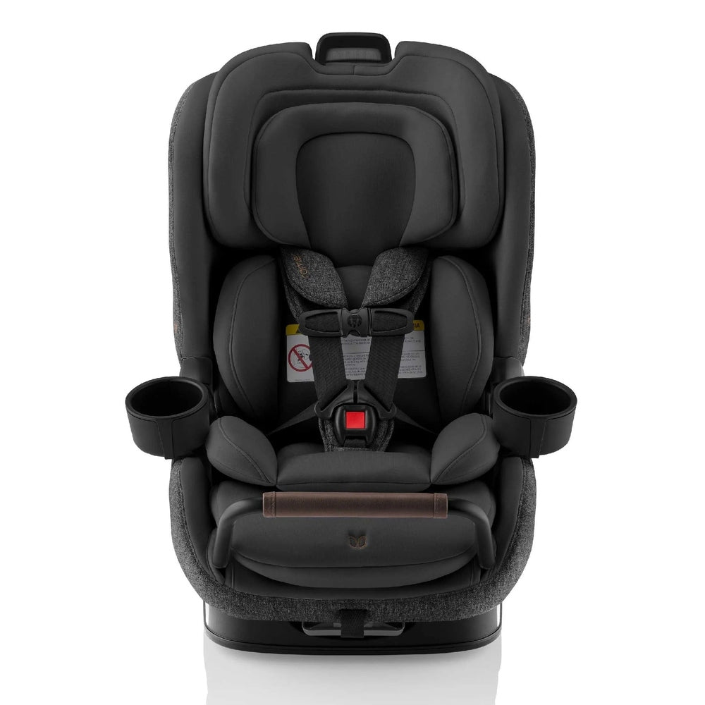 Romer Veni Convertible Car Seat in charcoal gray, featuring a secured 5-point harness and side cup holders.