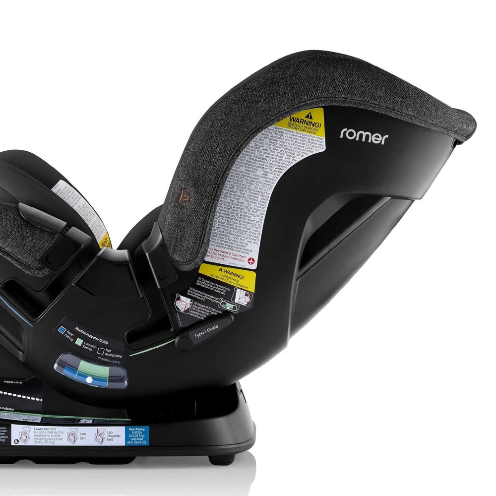 Romer Veni Convertible Car Seat, black, side view with warning labels and cushioned headrest.