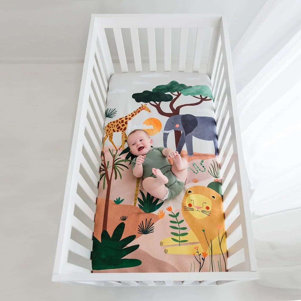 Rookie Humans cotton sateen crib sheet, Savanna print with giraffe, elephant and lion.