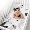 Rookie Humans cotton sateen crib sheet Woodland Dreams with woodland animals in a baby crib