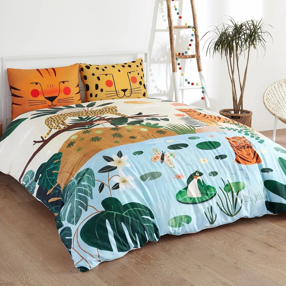 Rookie Humans Kids Bedding Set In The Jungle with orange tiger and leopard pillows and a colorful jungle duvet.