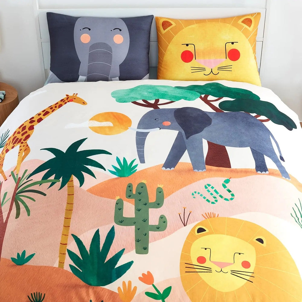 Rookie Humans Kids Bedding Set In The Savanna, bright elephant, giraffe and lion prints on a white duvet with matching animal pillows