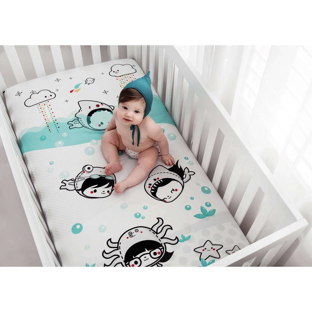 Rookie Humans Dive In crib sheet in teal sea-creature print; organic cotton sateen, single sheet