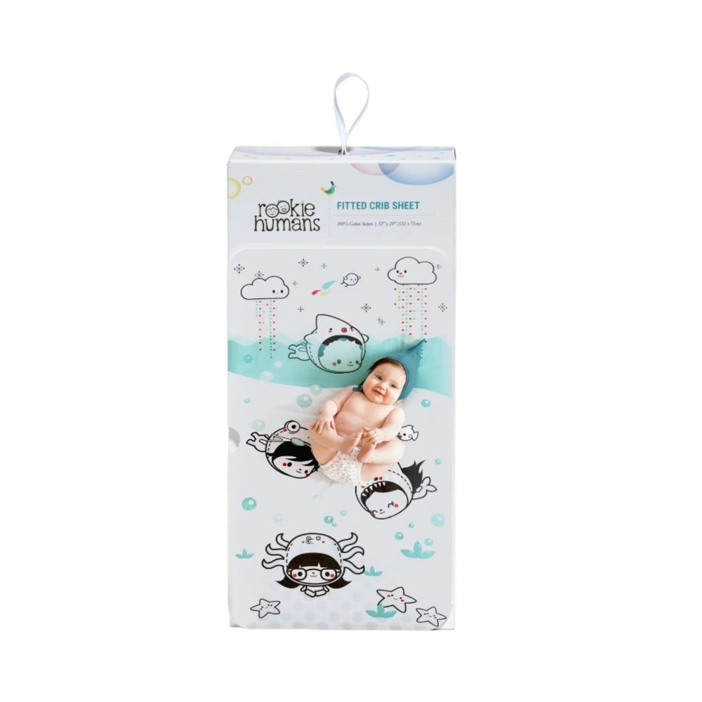 Rookie Humans Dive In crib sheet in organic cotton sateen with teal undersea scene and friendly animated characters.