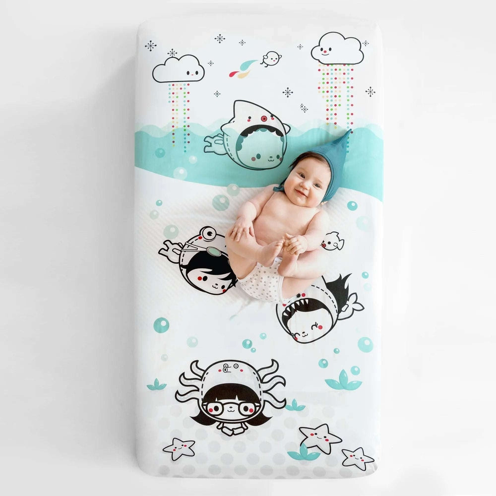 Rookie Humans Dive In crib sheet, organic cotton sateen with teal sea monsters and waves