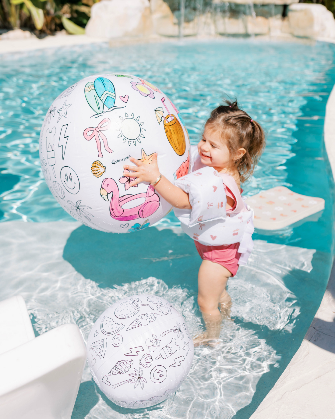 Cherrypick Design Your Own Beach Ball Kit child playing in pool