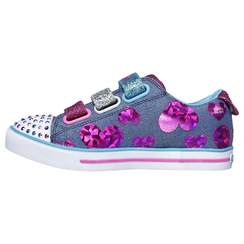 Skechers Twinkle Toes Sparkle Lite Flutter Fab toddler sneaker in blue denim with pink glitter hearts, Velcro straps fastened.