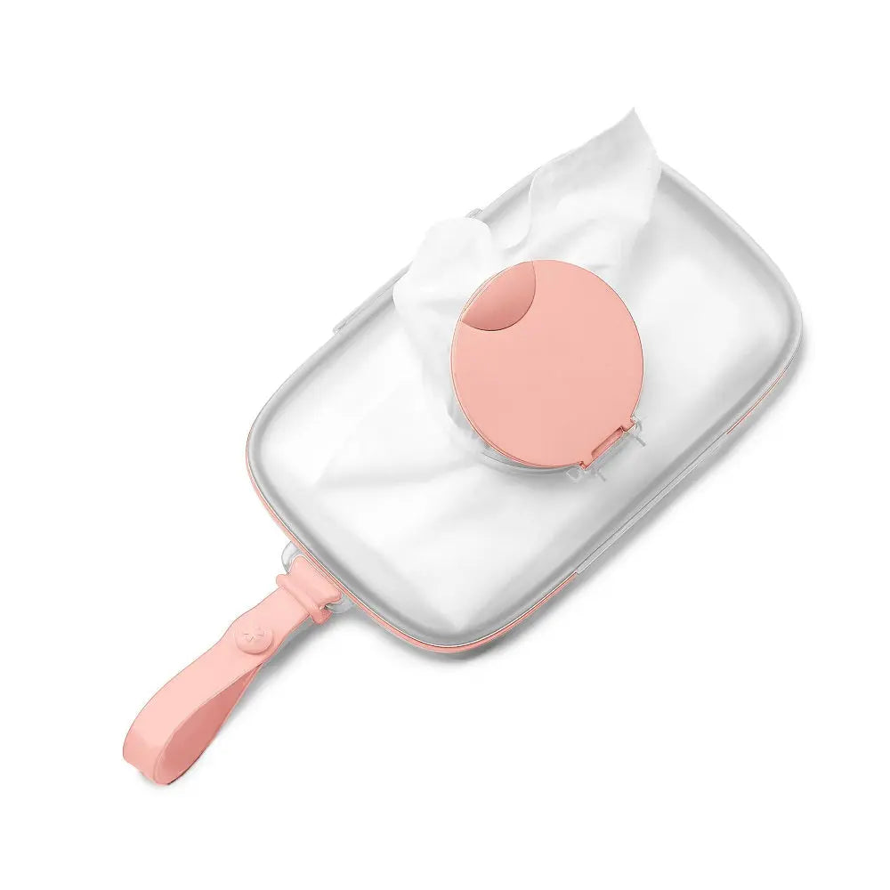 Skip Hop Grab & Go Snug Seal wipes case in pink with round lid sealing wipes for on-the-go parents
