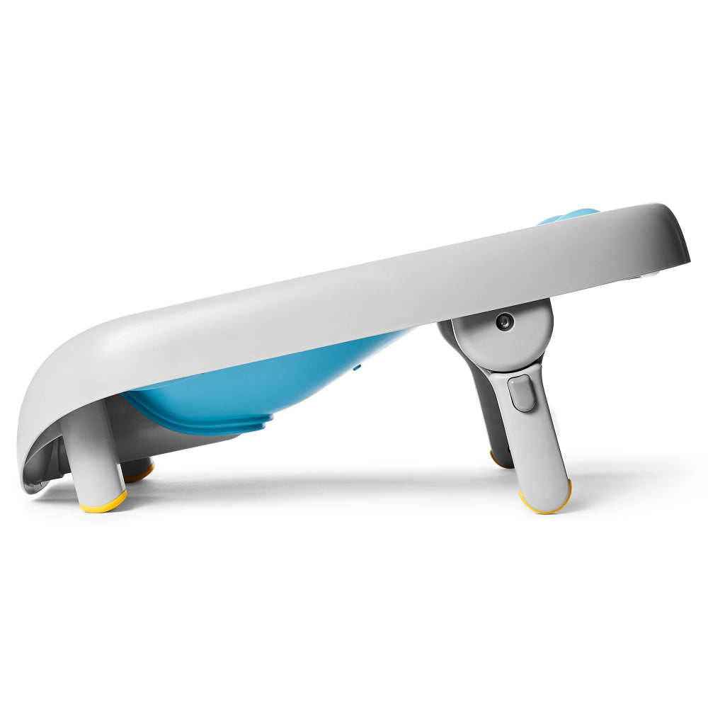 Skip Hop Moby Recline and Rinse Bather with blue tub, gray frame, and yellow feet