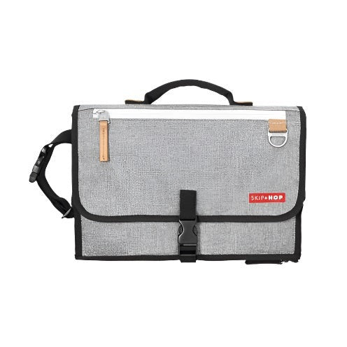 Skip Hop Pronto Signature Changing Station in grey melange fabric with black trim and buckle.