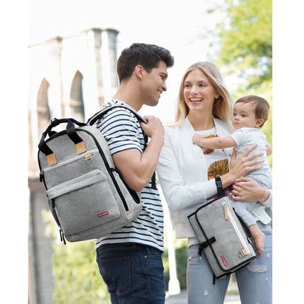 Skip Hop Pronto Signature gray melange changing bags (2): matching backpack and diaper bag on a family outing