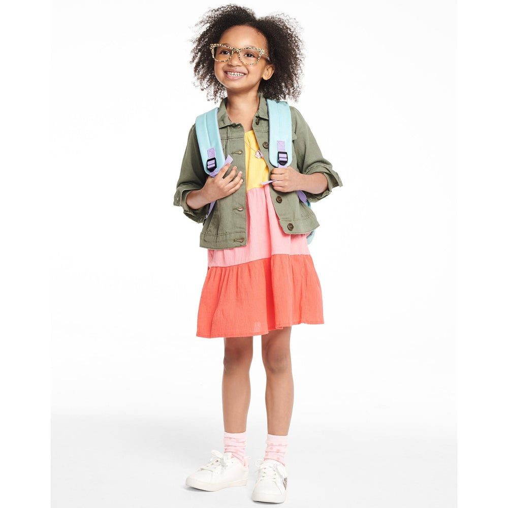 Skip Hop Zoo Big Kid Backpack Koala in light blue with purple straps on a smiling girl