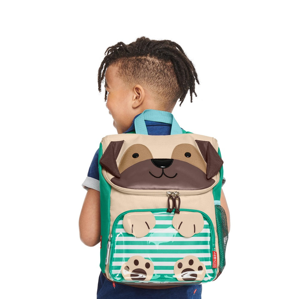 Skip Hop Zoo Big Kid Backpack Pug with puppy-face flap, teal straps, beige body, and green striped front pocket
