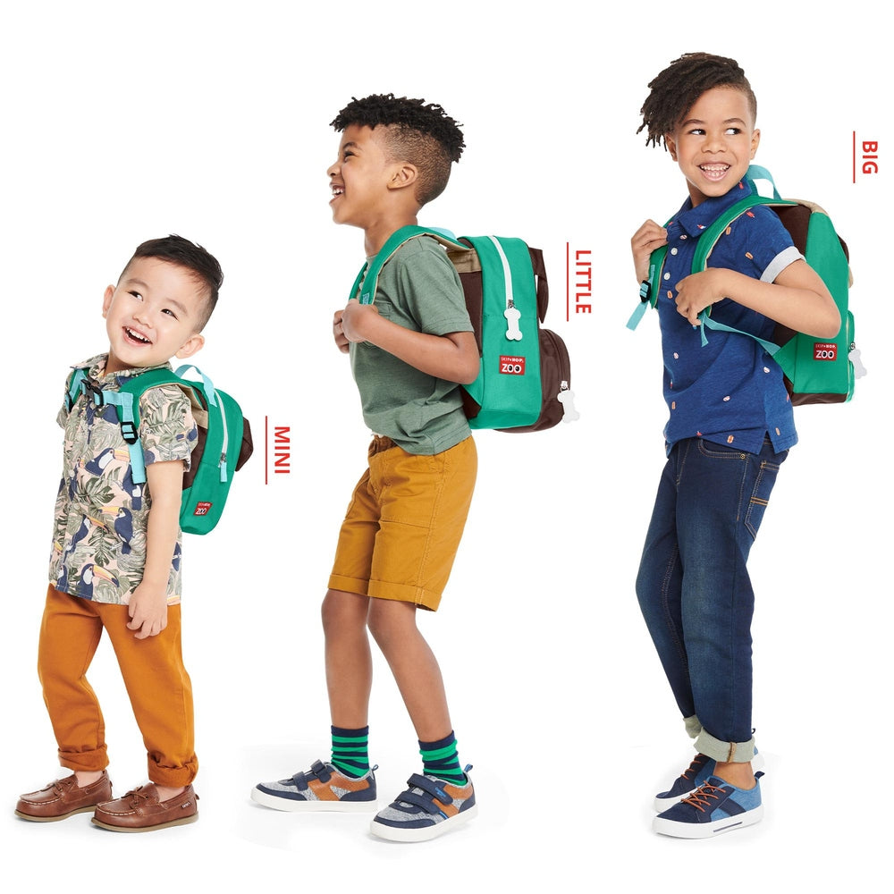 Skip Hop Zoo Big Kid Backpack Pug; three kids wear green backpacks with bone charms.