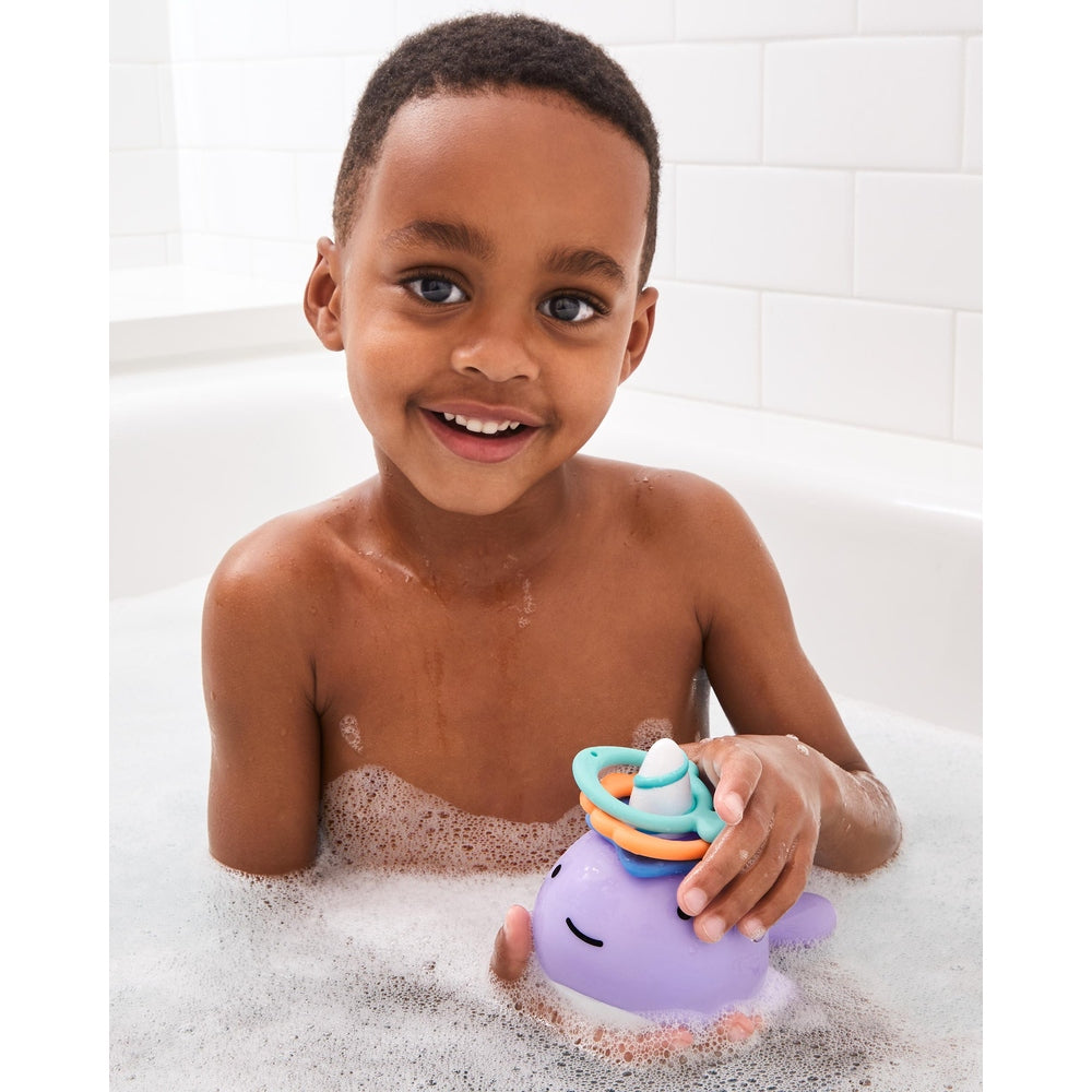 Skip Hop Zoo Narwhal Ring Toss bath toy, purple narwhal with bright stacked rings