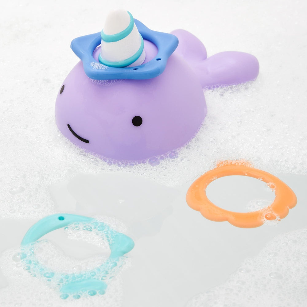 Skip Hop Narwhal Ring Toss bath toy; purple narwhal with blue horn ring and orange/teal toss rings