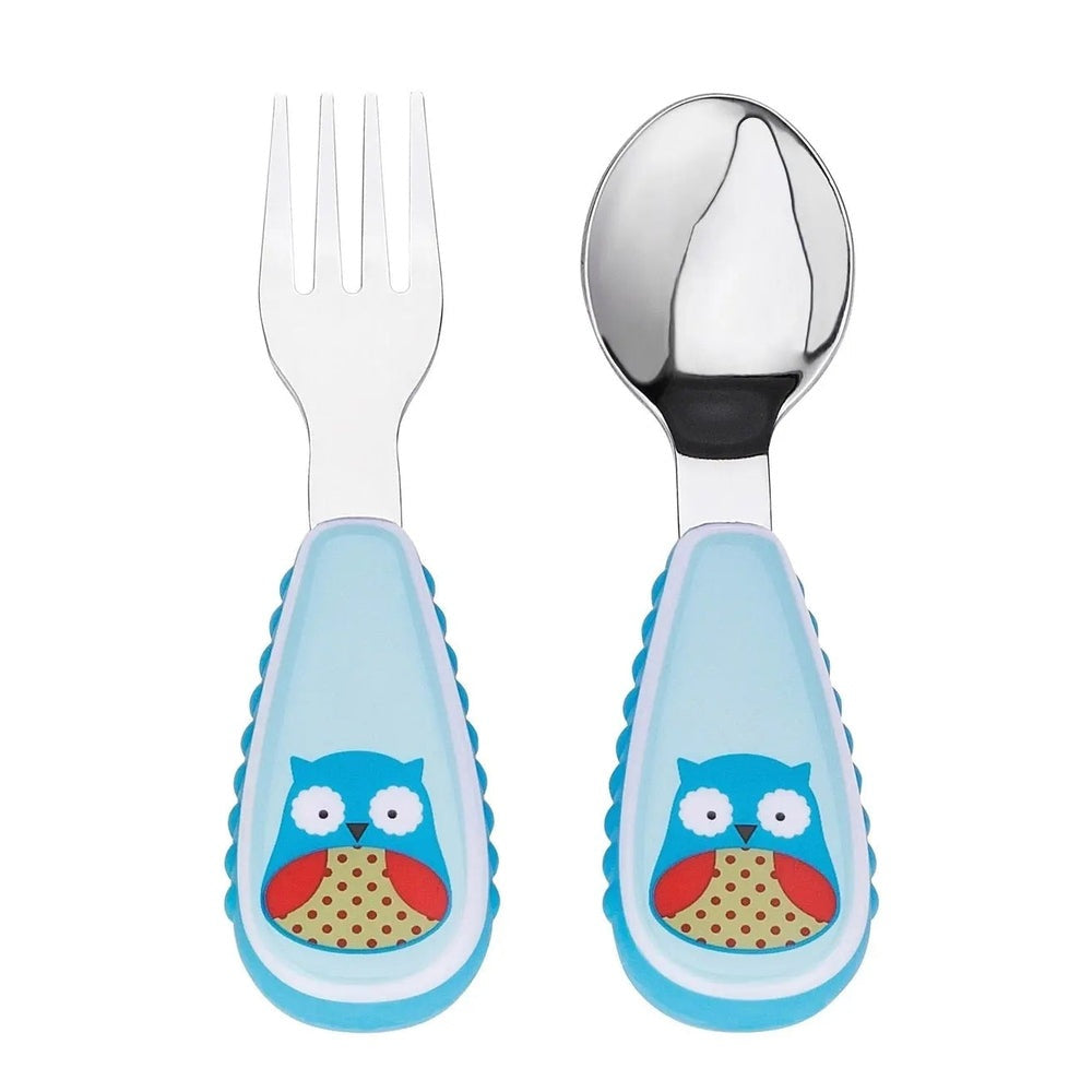 Skip Hop Zoo Utensil Set with two toddler utensils, blue owl handles; fork and spoon laid ready for mealtime.