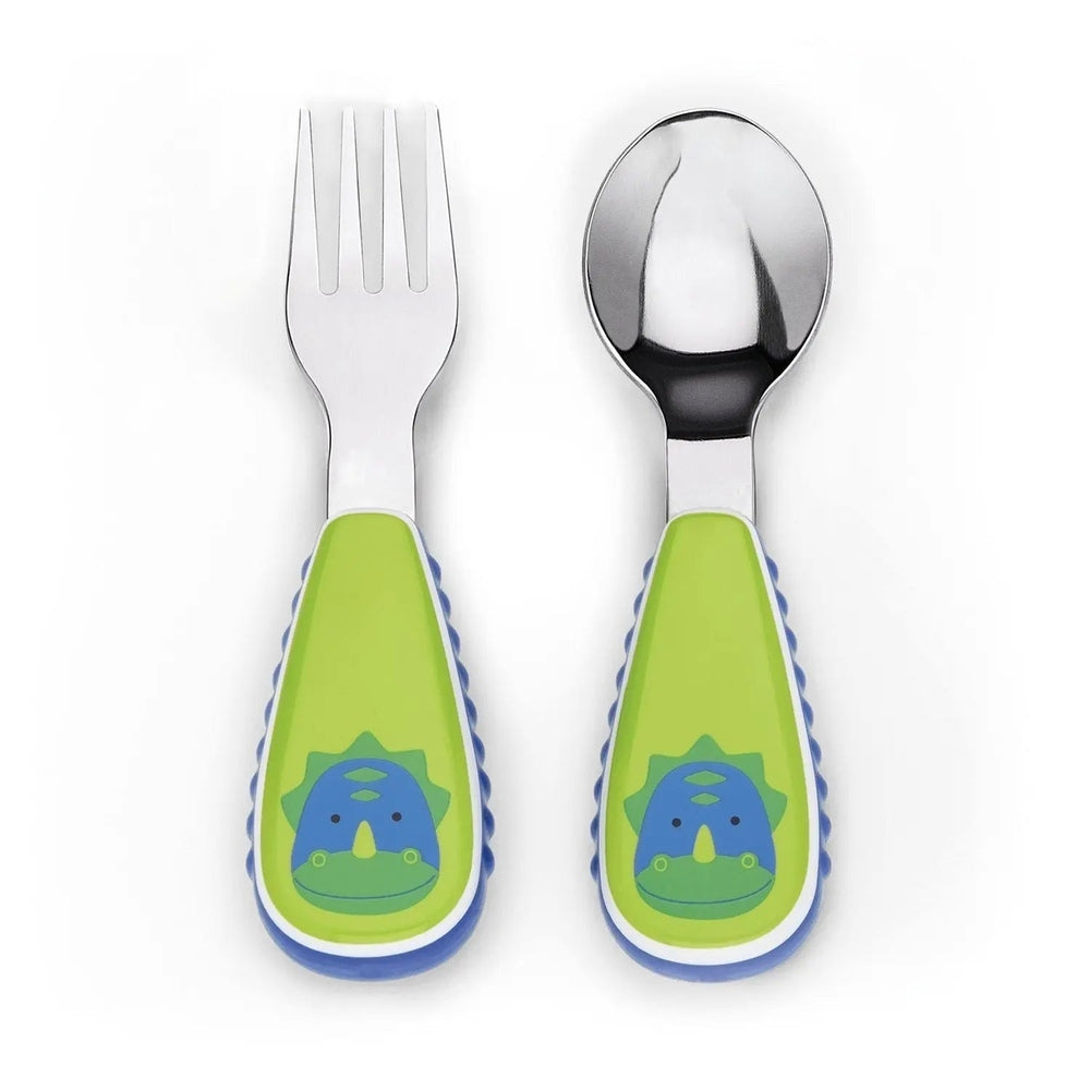 Skip Hop Zoo Utensil Set for toddlers; green dinosaur-handled fork and spoon with stainless steel heads.