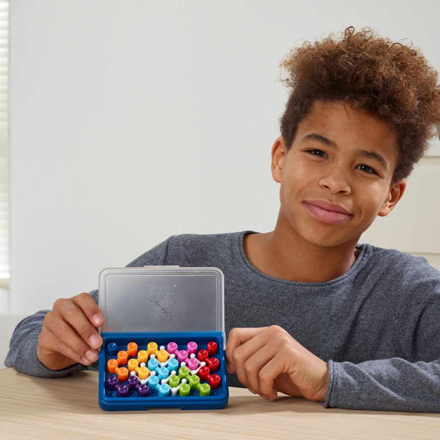 IQ Blox puzzle in a blue carrying case with colorful pegs; SMART GAMES educational toy.