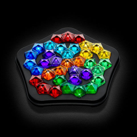 Smart Games IQ Deluxe Pentagon puzzle with multicolor gem pieces on a black tray