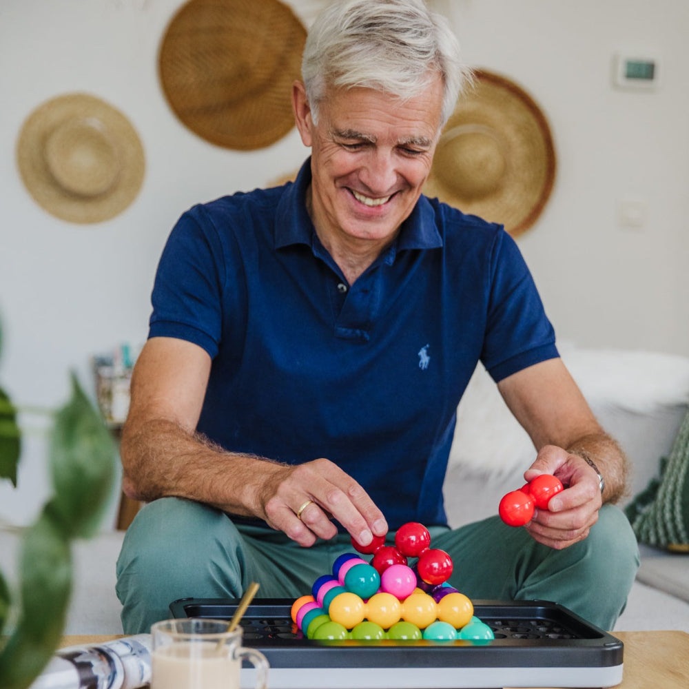 Smart Games IQ Puzzler Pro XXL puzzle game with multicolor spheres on a tray