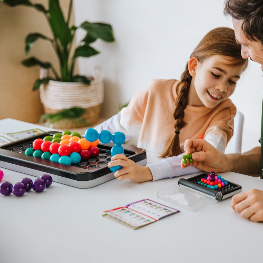 Smart Games IQ Puzzler Pro XXL puzzle game with colorful bead pegs for kids and adults