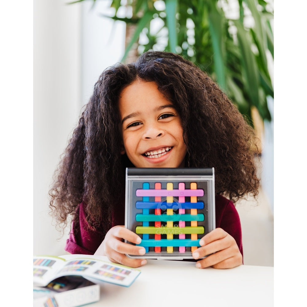 Smart Games IQ Stixx puzzle game in a clear case with multicolor plastic sticks; smiling girl.