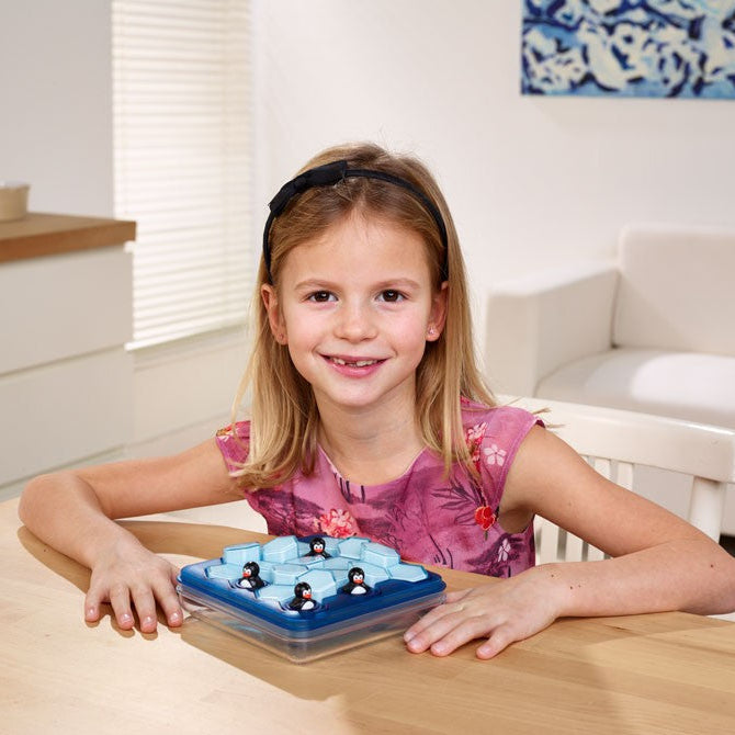 Penguins Pool Party puzzle by SMART GAMES in a blue tray with hex tiles and penguin figures