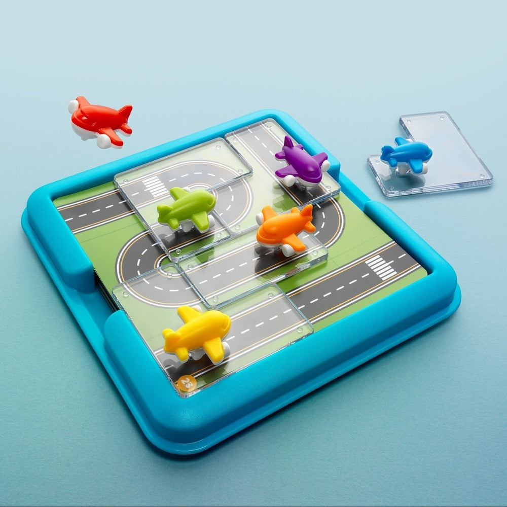 Colorful toy airplane set on a blue play mat with a light blue background