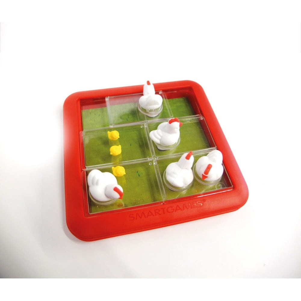 SmartGames Chicken Shuffle Jr board game in a red frame with white chickens and yellow chicks on a green grid