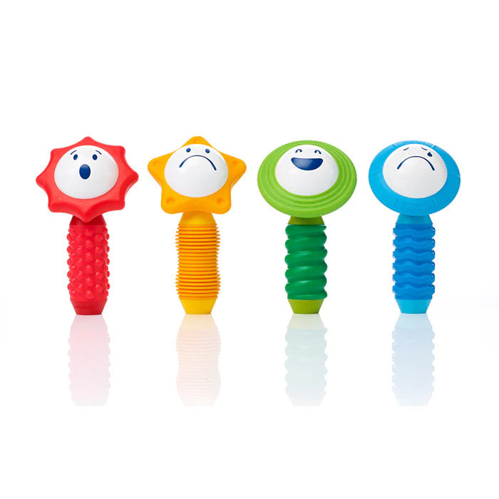 SmartMax My First Sounds and Senses 4-piece set of colorful grip toys with star and circle heads.