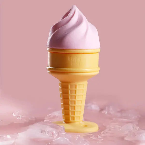 Smily Mia & Dommy Ice Cream Freezable Teether, pink swirl top on a yellow waffle cone resting on pink icy surface.