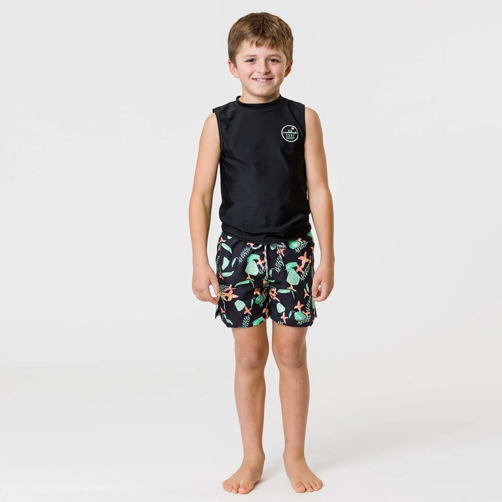Snapper Rock Neon Rainforest Volley Board Short; black base with neon tropical print, shown on a smiling barefoot boy.
