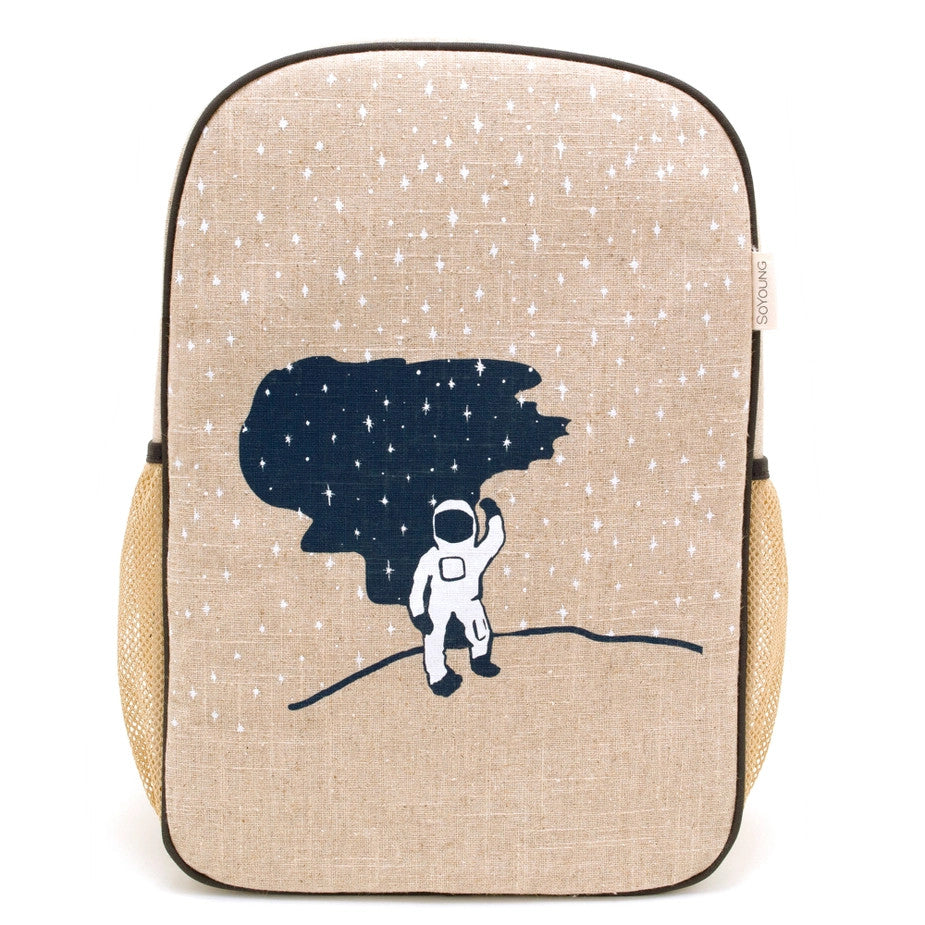 SoYoung Grade School Backpack in beige fabric with navy astronaut silhouette and star print, side mesh pockets.