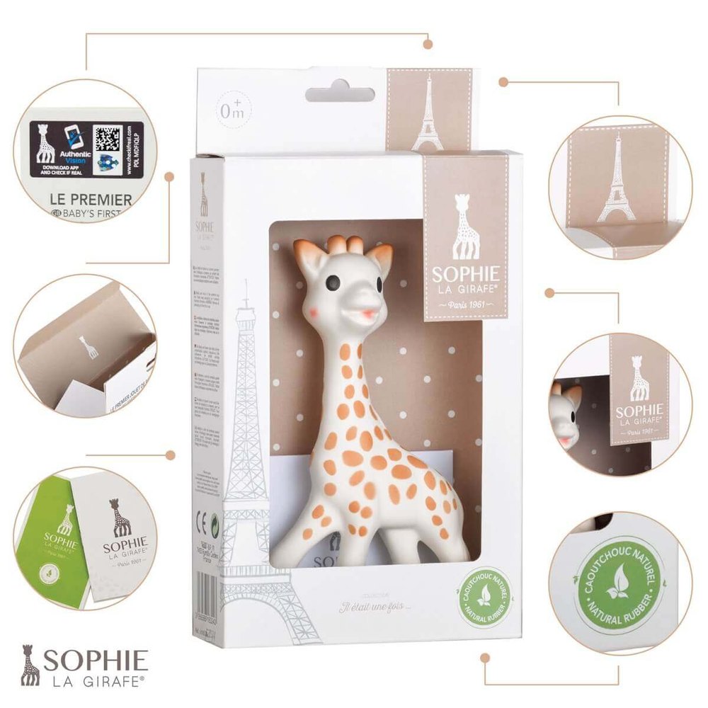 Sophie La Girafe teether in white with orange spots, boxed with beige Eiffel Tower motif