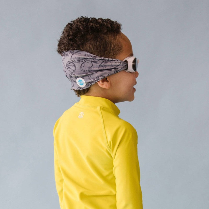 Splash Swim Goggles All Star for kids; child wears a yellow top and grey patterned headband.