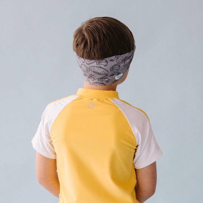 Splash Swim Goggles All Star; child wearing grey patterned headband and yellow shirt with white sleeves