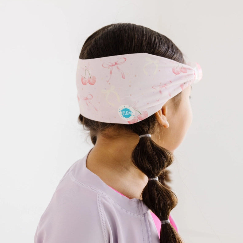 Splash Swim Goggles Cherry Charms pink cherry-pattern headband worn by child