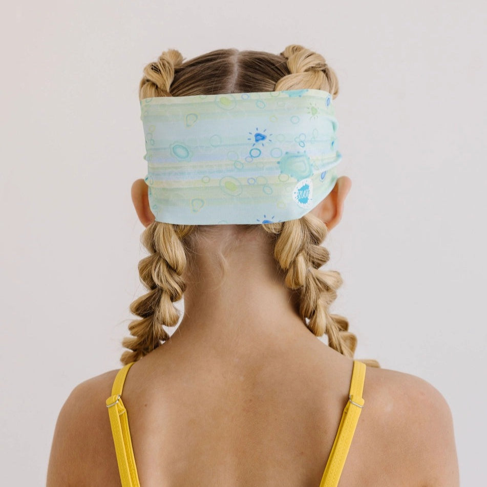Splash Swim Goggles Sea Glass headband, sea glass blue pattern, worn by a person with blonde braids